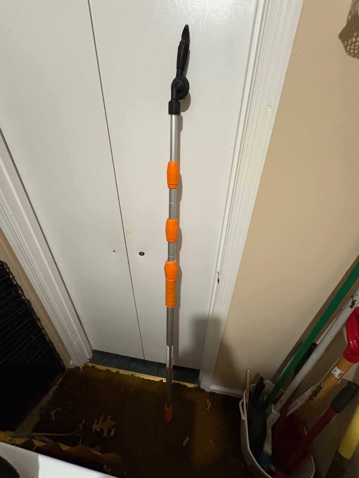 The Rhino Gutter Cleaner tool, with long handle. Used to clean gutters.