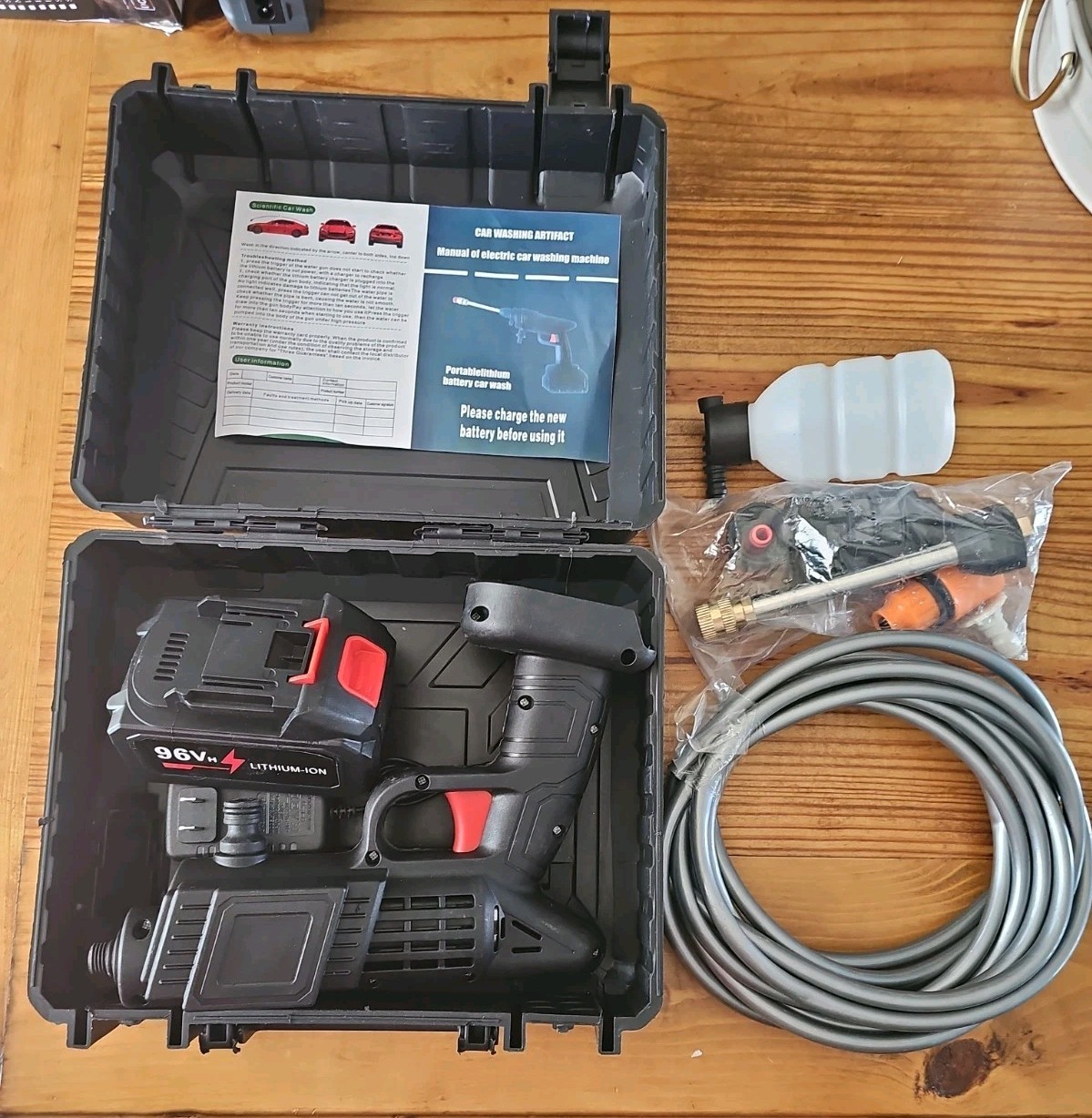 Portable Car Washer Gun with Lithium Battery pack and accessories.